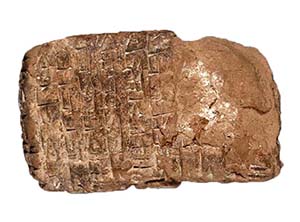 Ancient-looking stone with human made lines inscribed in it